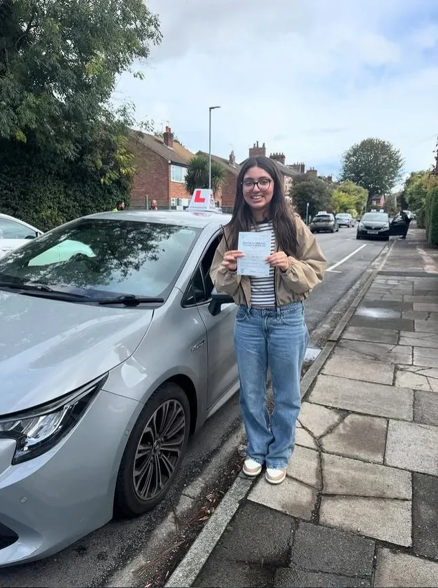 A Learn Local learner holding their driving test pass certificate (photo 8 of 8)